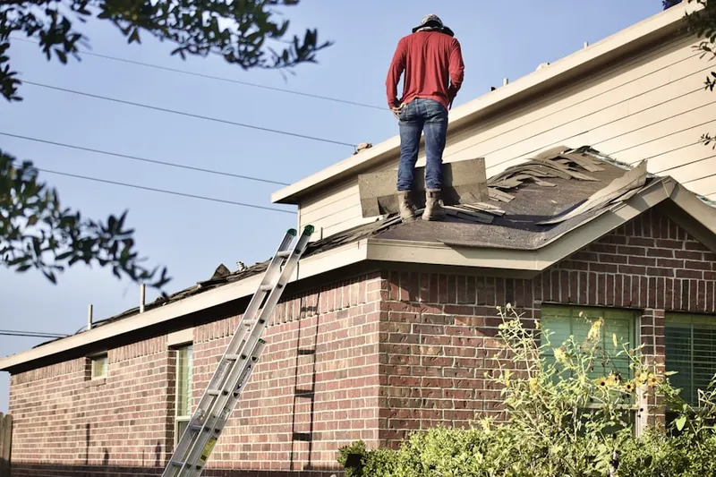 Professional roofer working on a residential roof in Goodhue